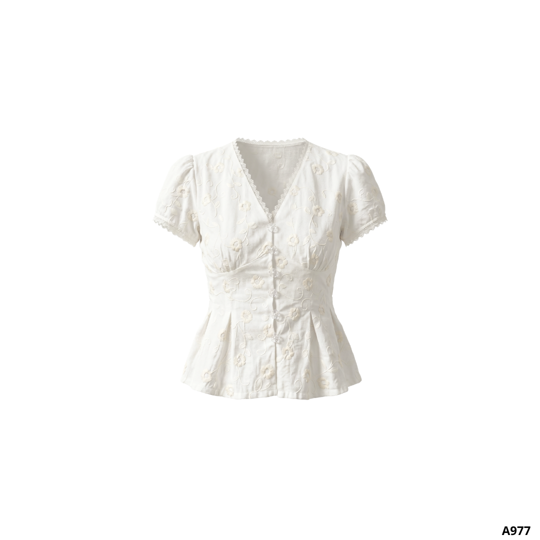 A977