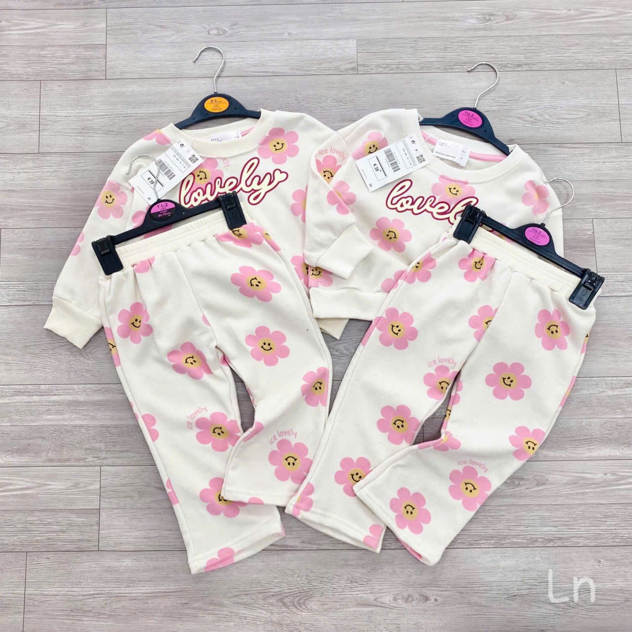 Bộ nỉ áo be quần be in hoa tràn