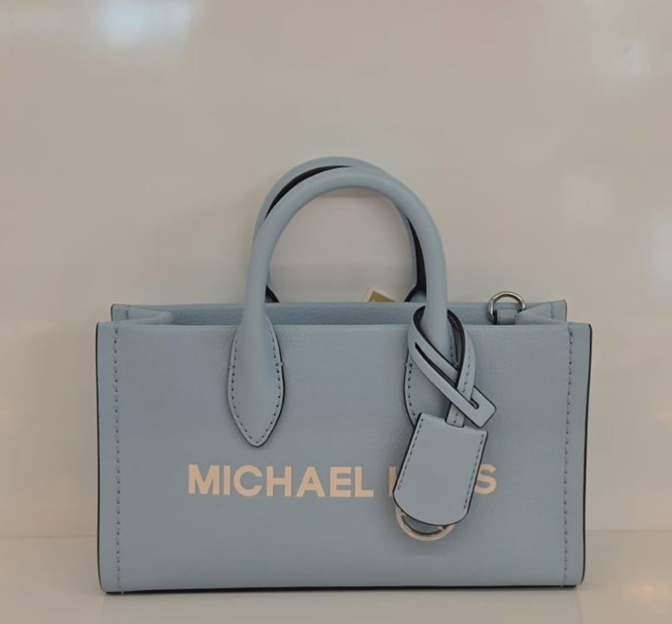 Túi MK đeo chéo mirella small màu xanh logo bạc -20x11x6