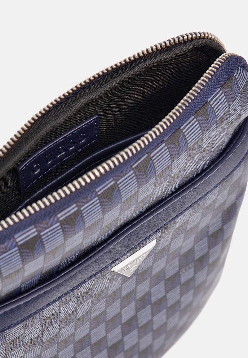 Túi đeo chéo Guess xanh navy - KT: 20x24