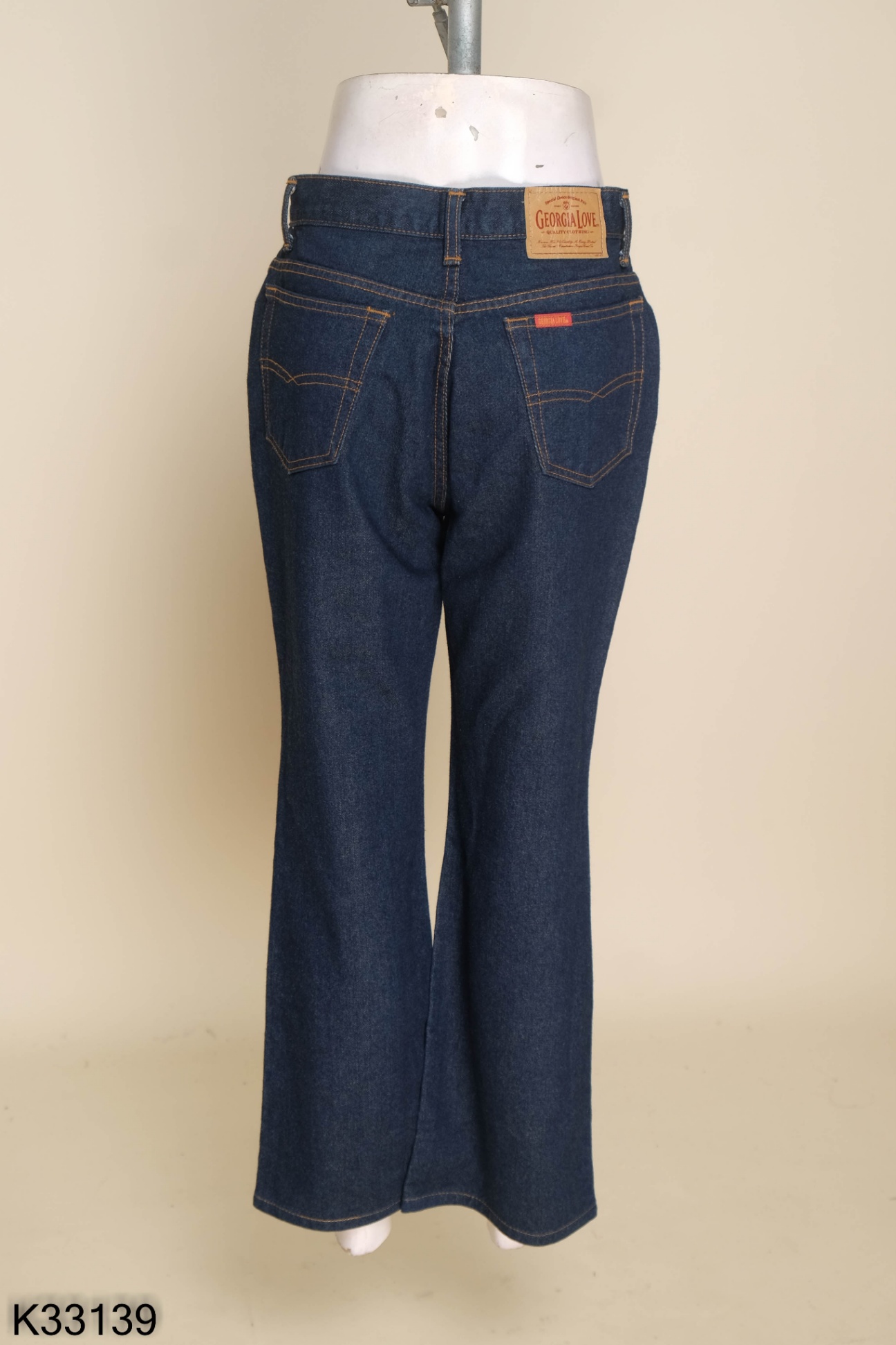 Quần jeans xanh viền chỉ nâu