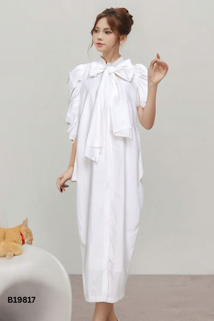 Váy trắng tay phồng thắt nơ