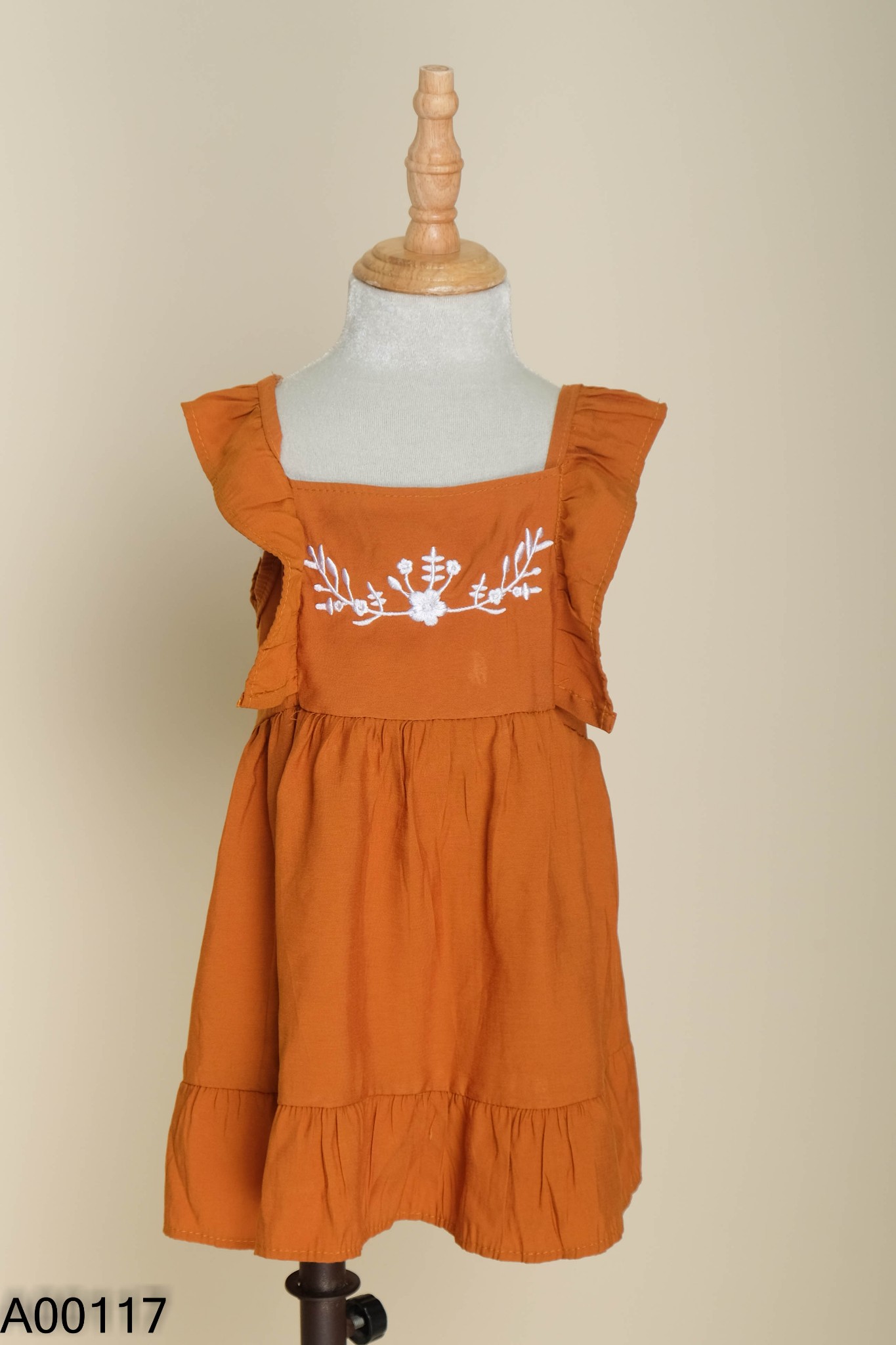 Váy nâu thêu hoa trắng KIDS