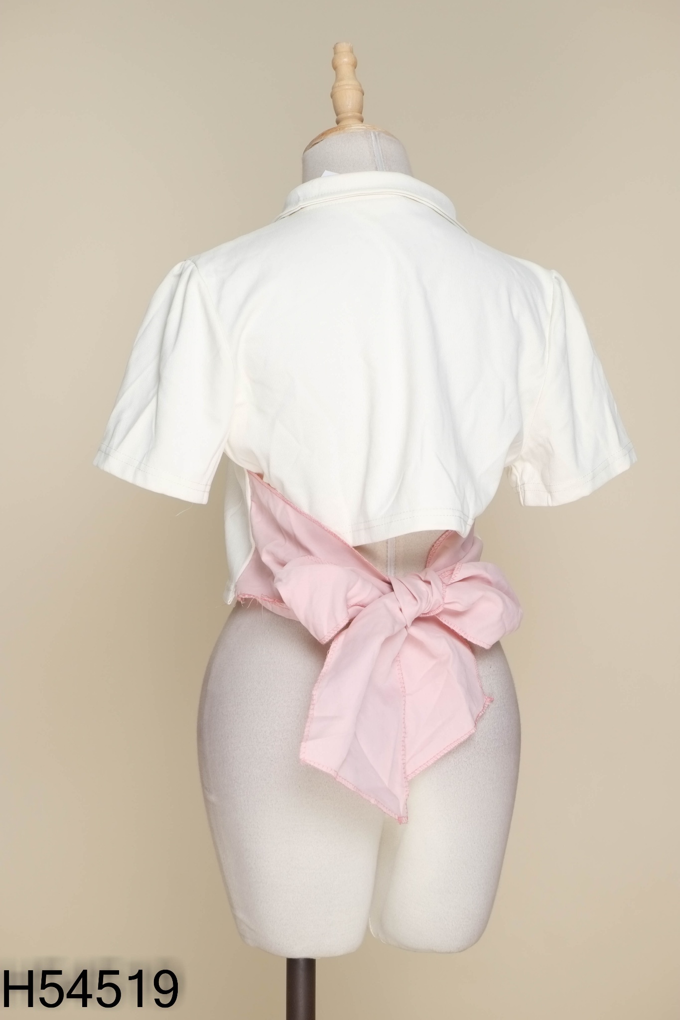 Áo be cổ polo buộc nơ hồng