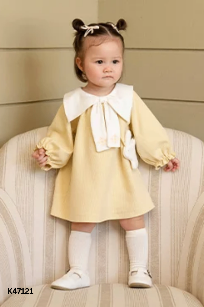 Váy vàng phối cổ nơ KIDS