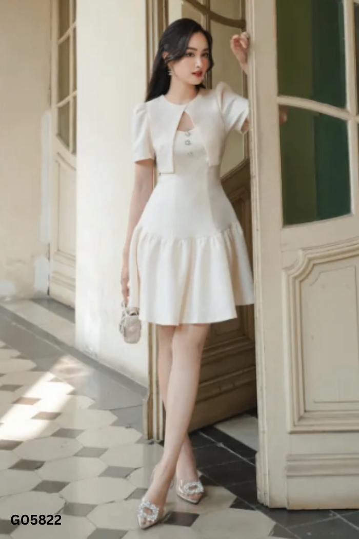 Váy be TIIN cúc ngọc