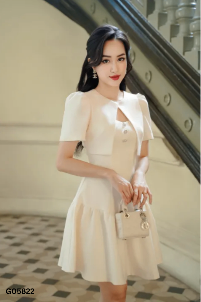Váy be TIIN cúc ngọc