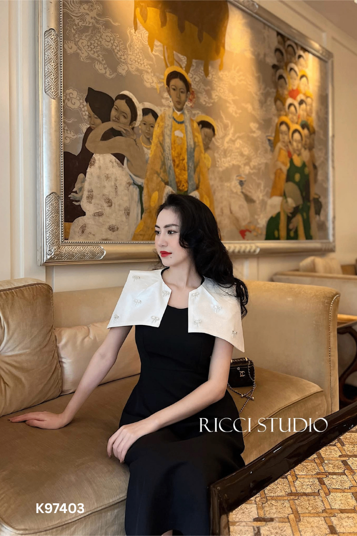 Váy RICCI đen phối vai trắng đính nơ đá