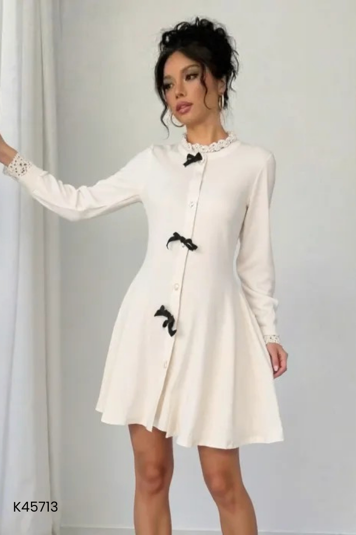 Váy len be nơ đen mix viền ren