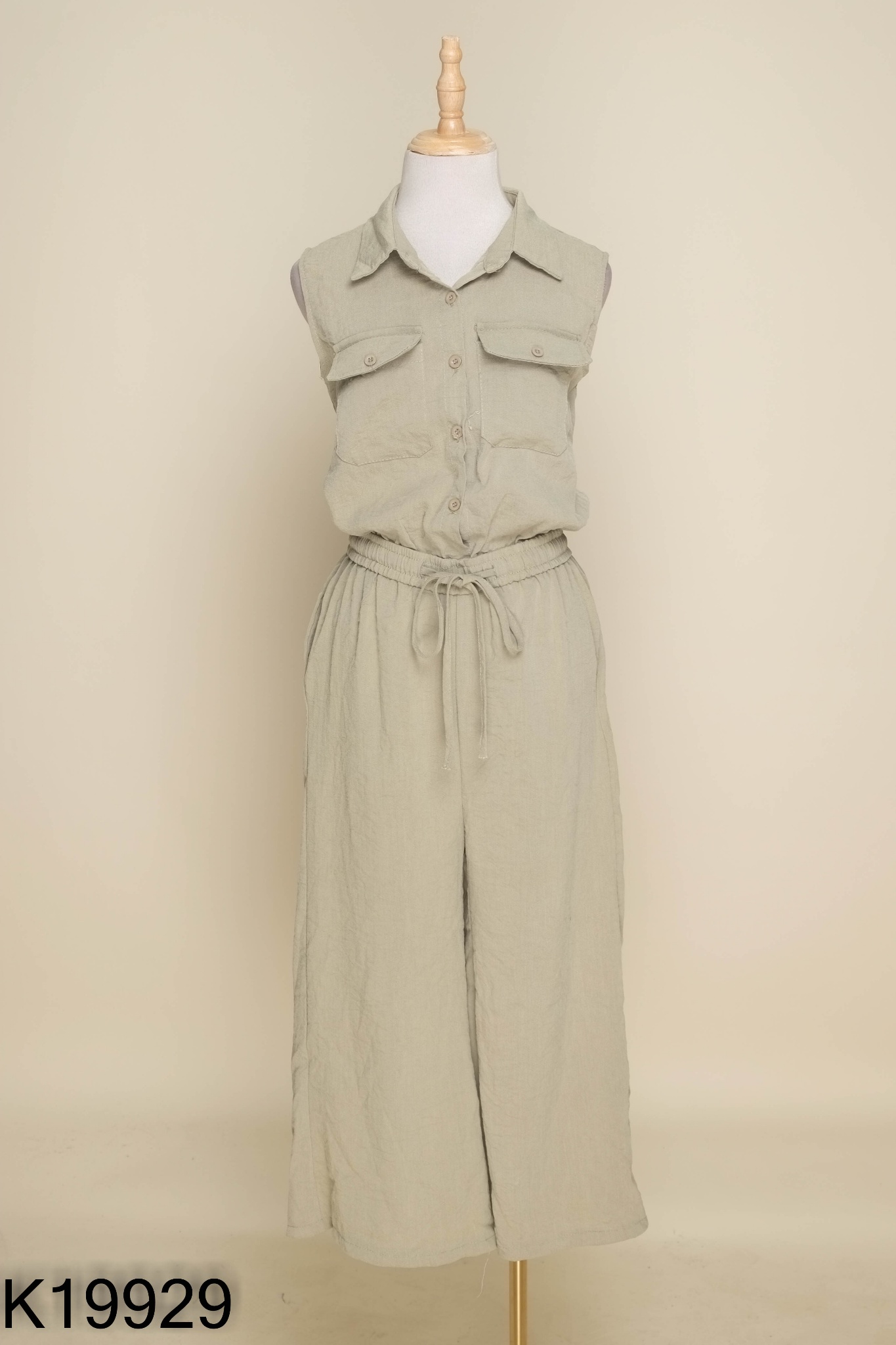 Jumpsuit xanh sát nách