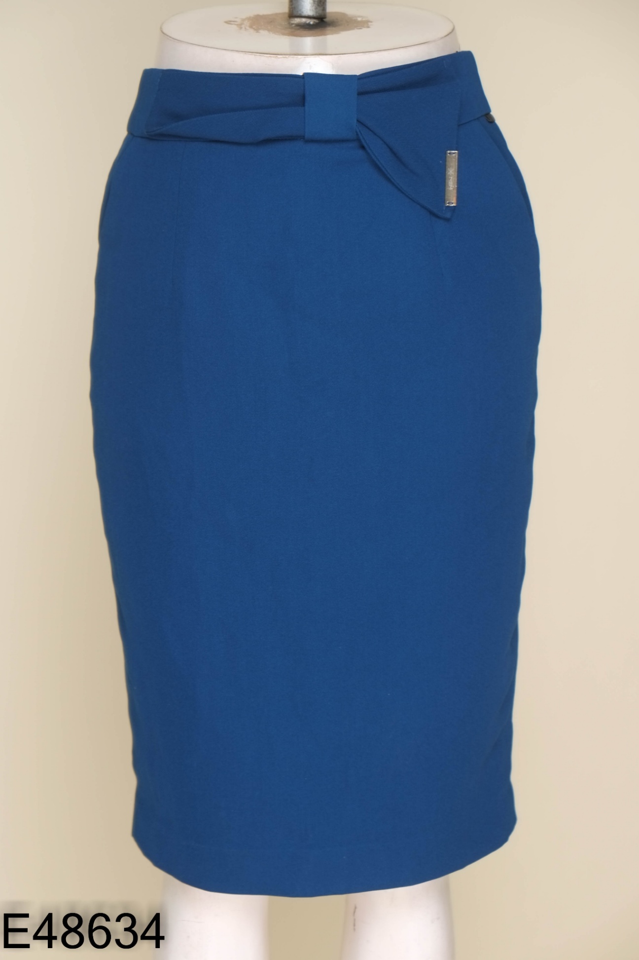 Chân váy NEM xanh đính nơ