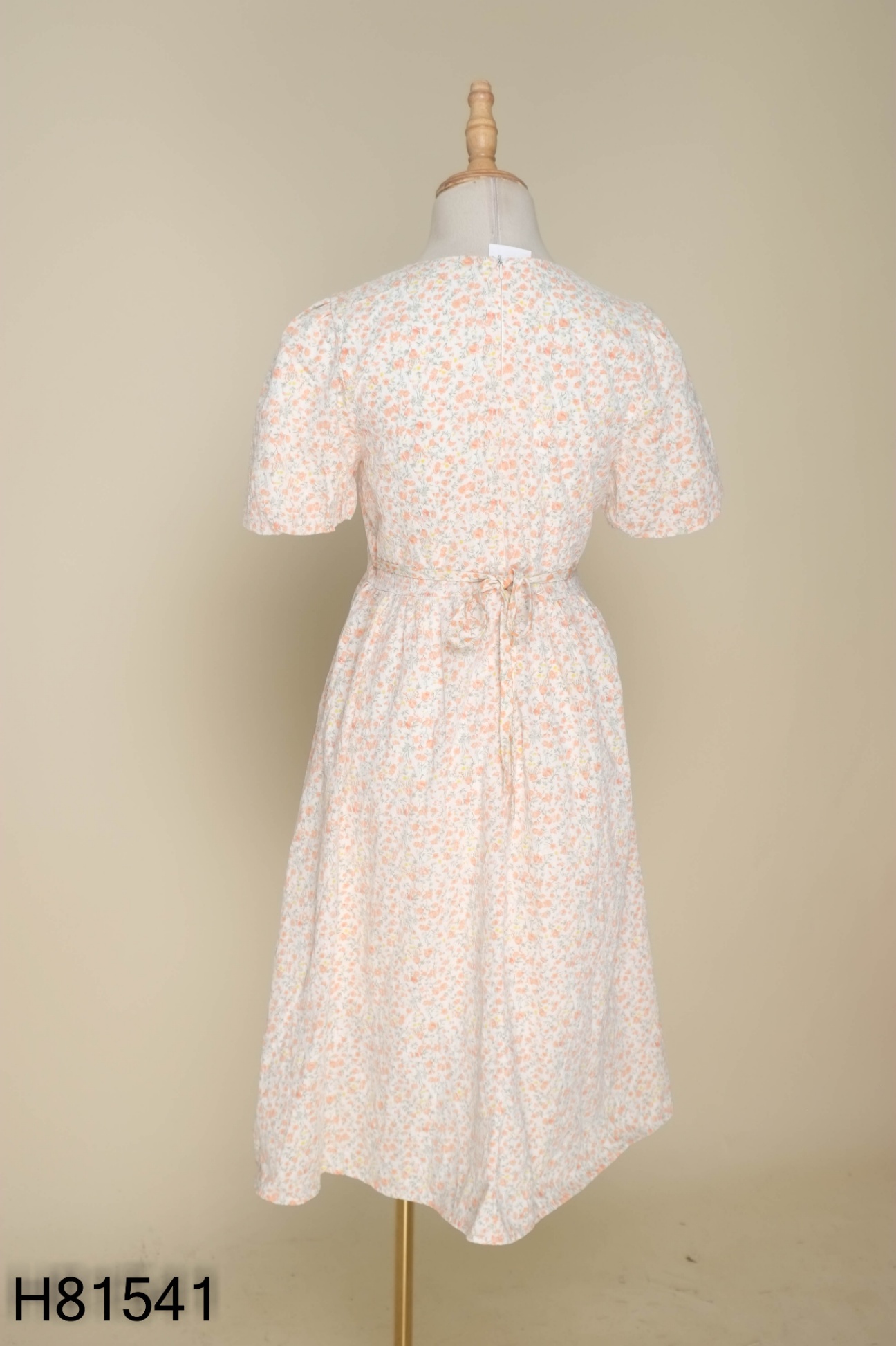 Váy be họa tiết hoa nhí cam