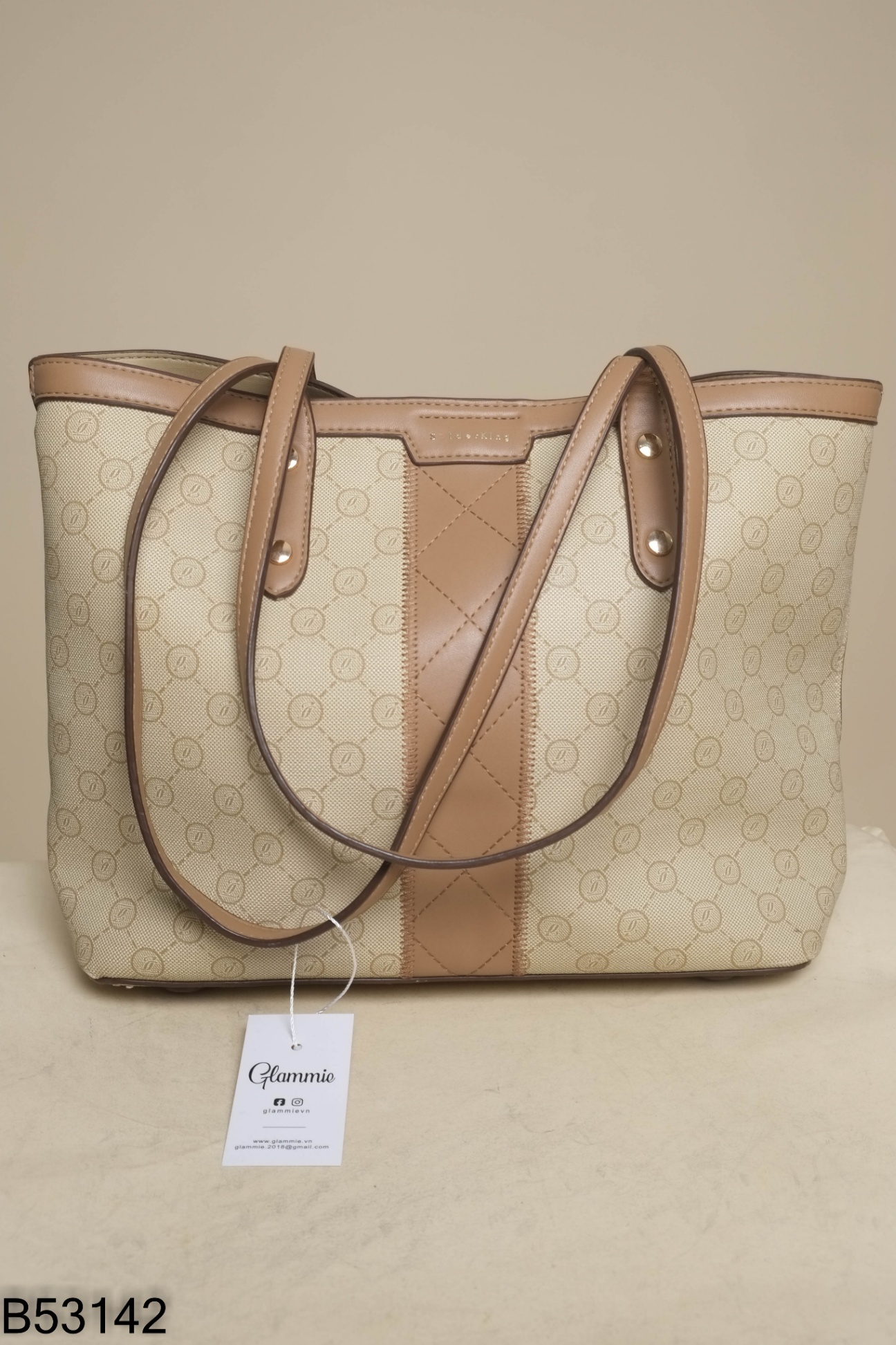 Túi da nâu be họa tiết