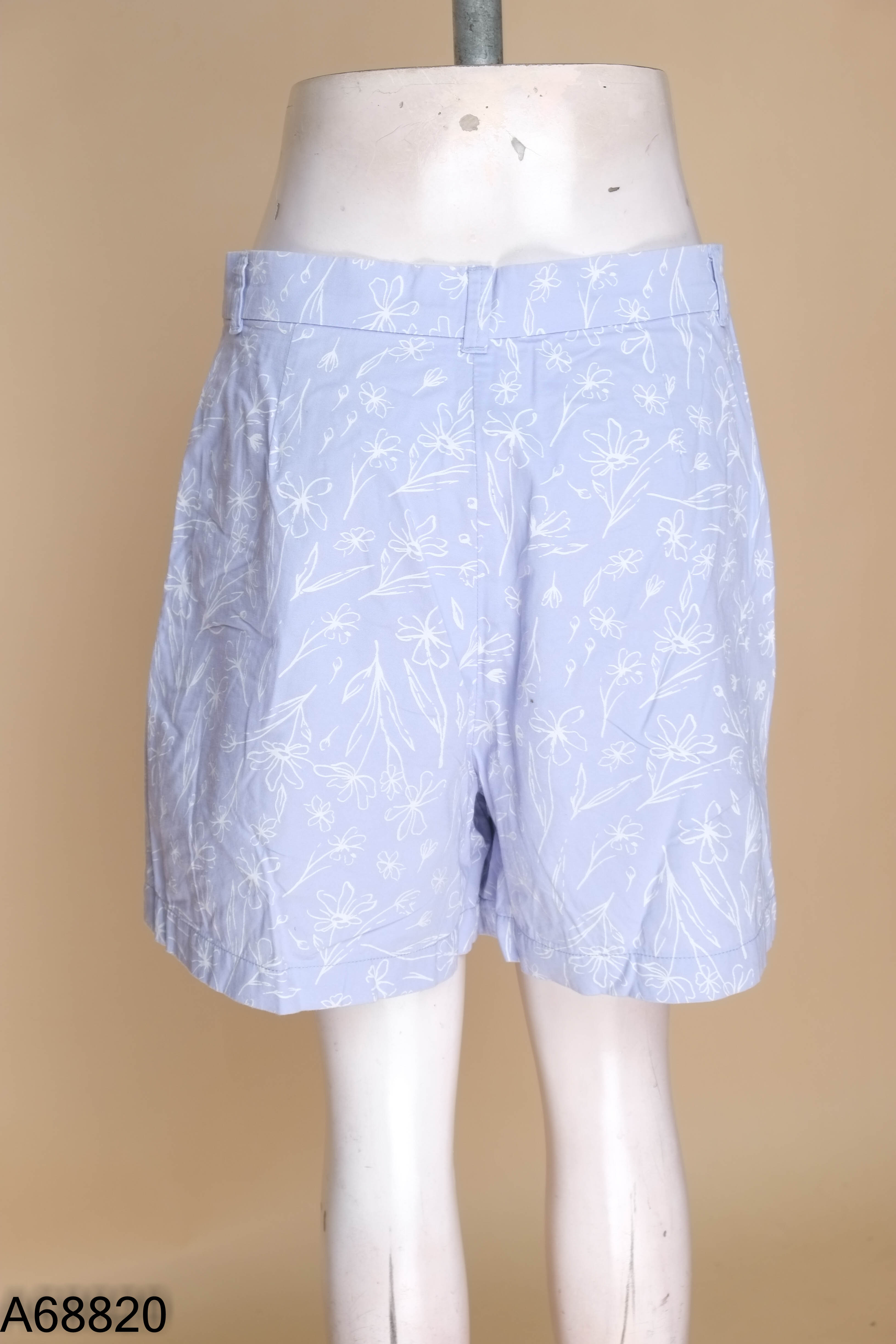 Quần short CANIFA tím họa tiết hoa trắng