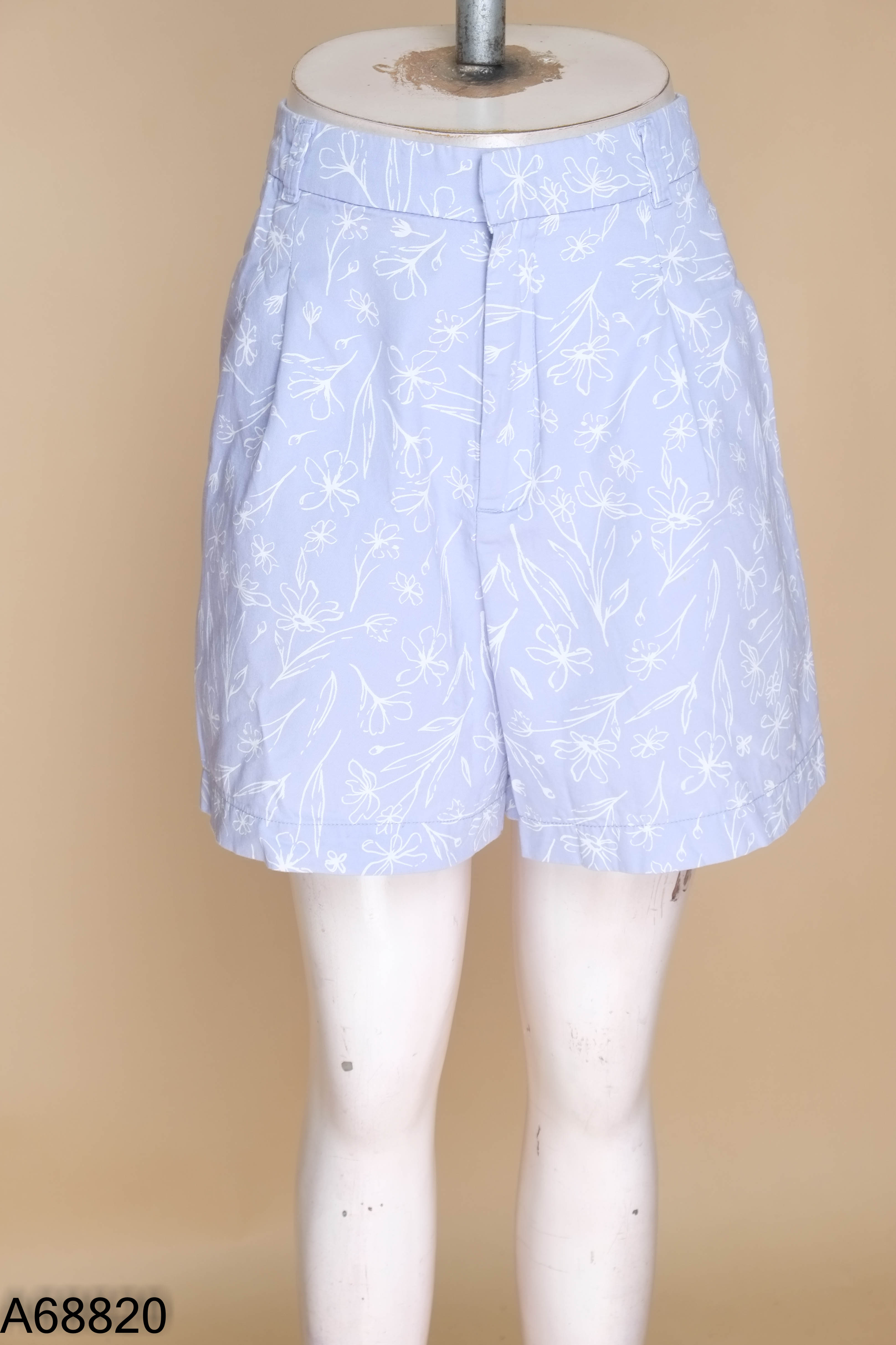 Quần short CANIFA tím họa tiết hoa trắng