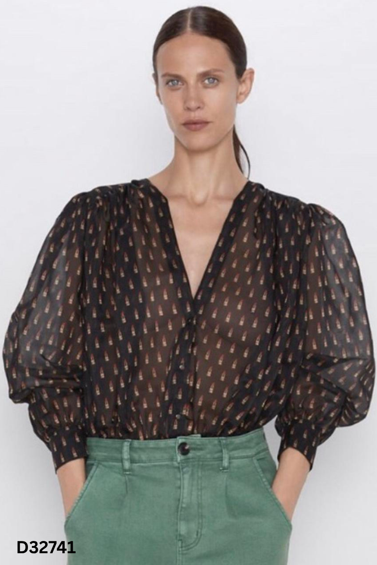 Jumpsuit đen họa tiết