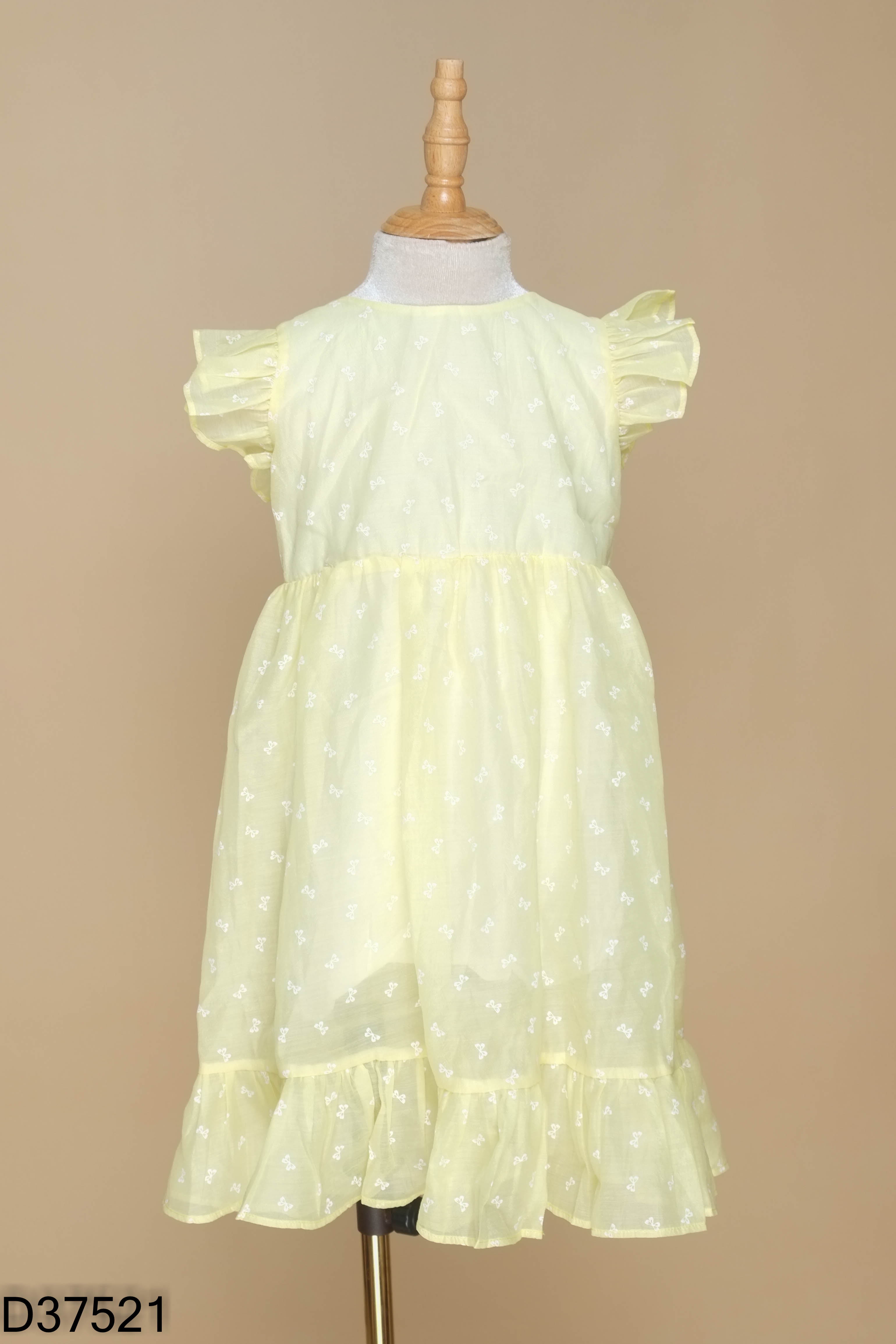 Váy babydoll vàng họa tiết nơ KIDS