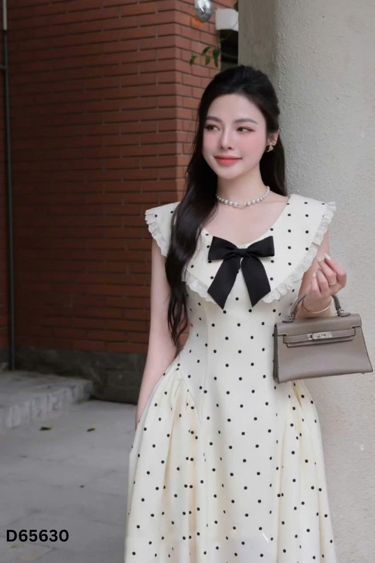 Váy be dáng dài chấm bi đính nơ đen