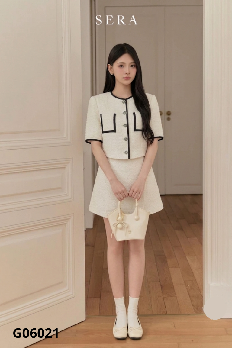 Set áo viền đen + chân váy trắng ngà