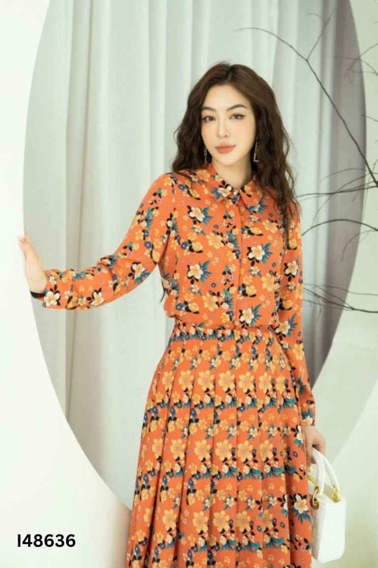 Set áo + chân váy SIX DO cam họa tiết