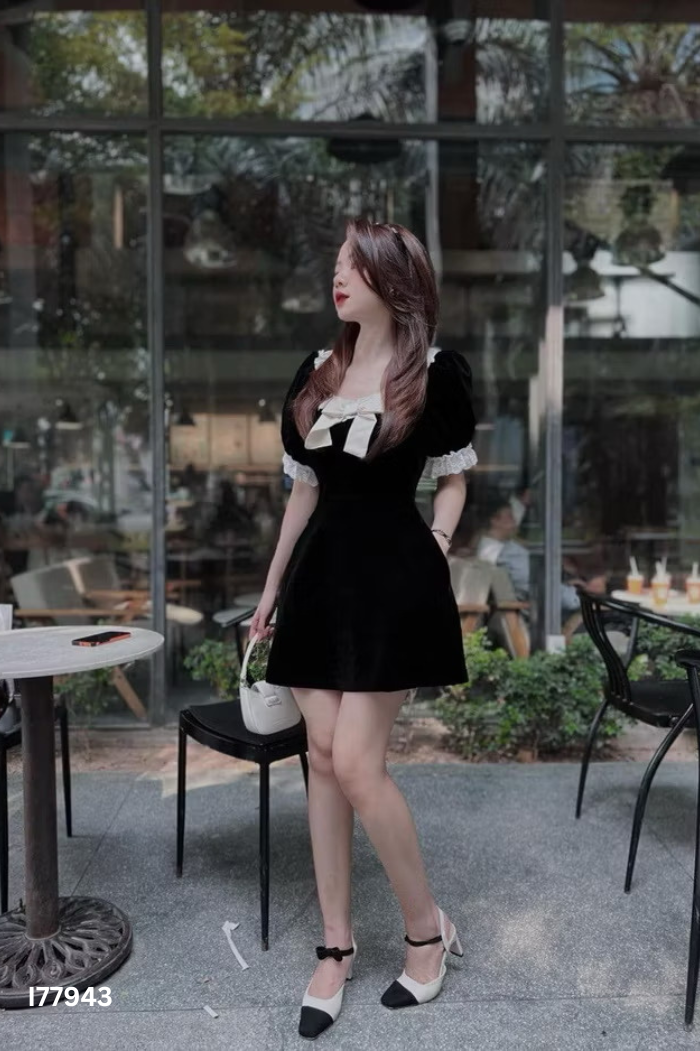 Váy nhung đen phối nơ be