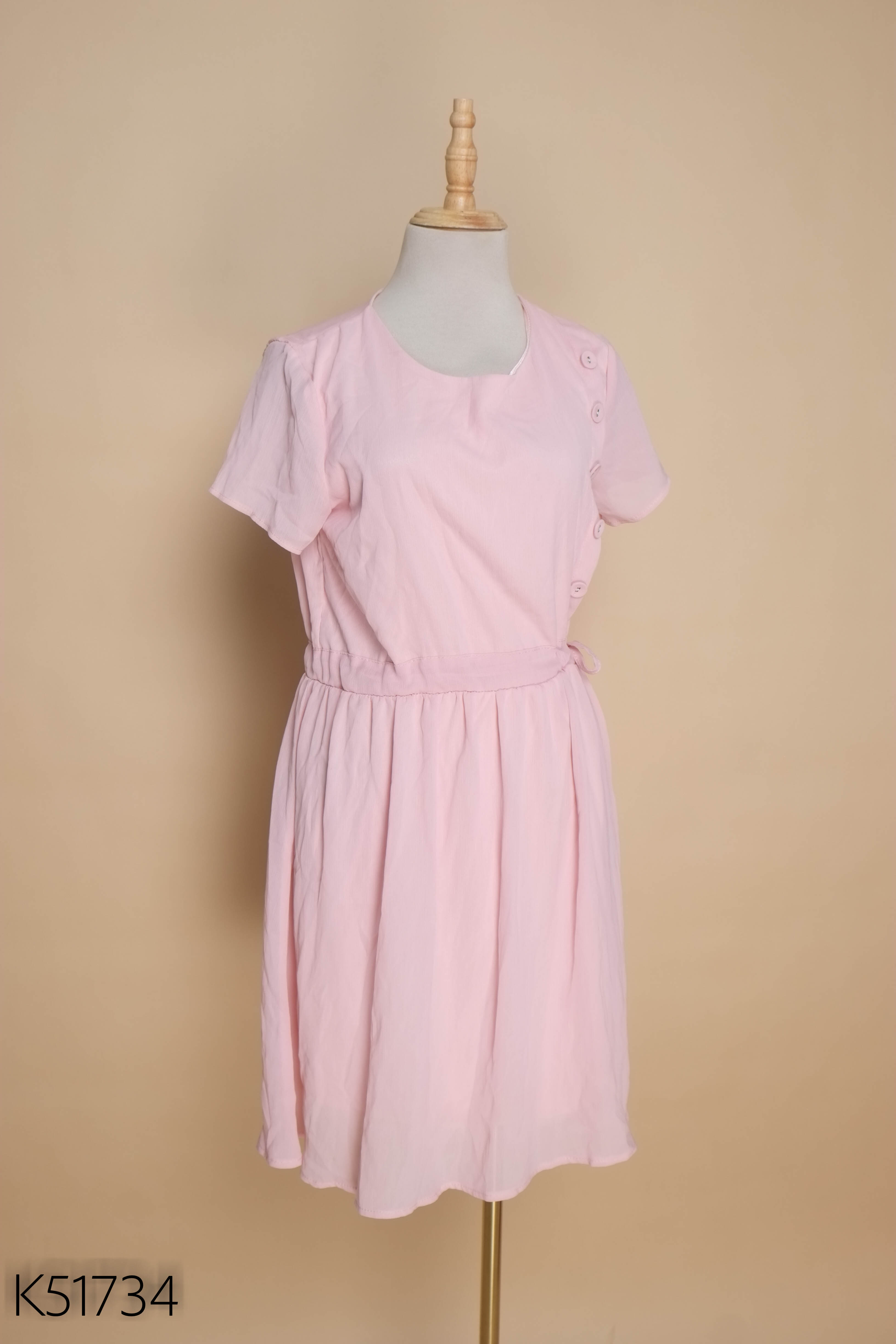 Váy hồng phối khuy baby doll