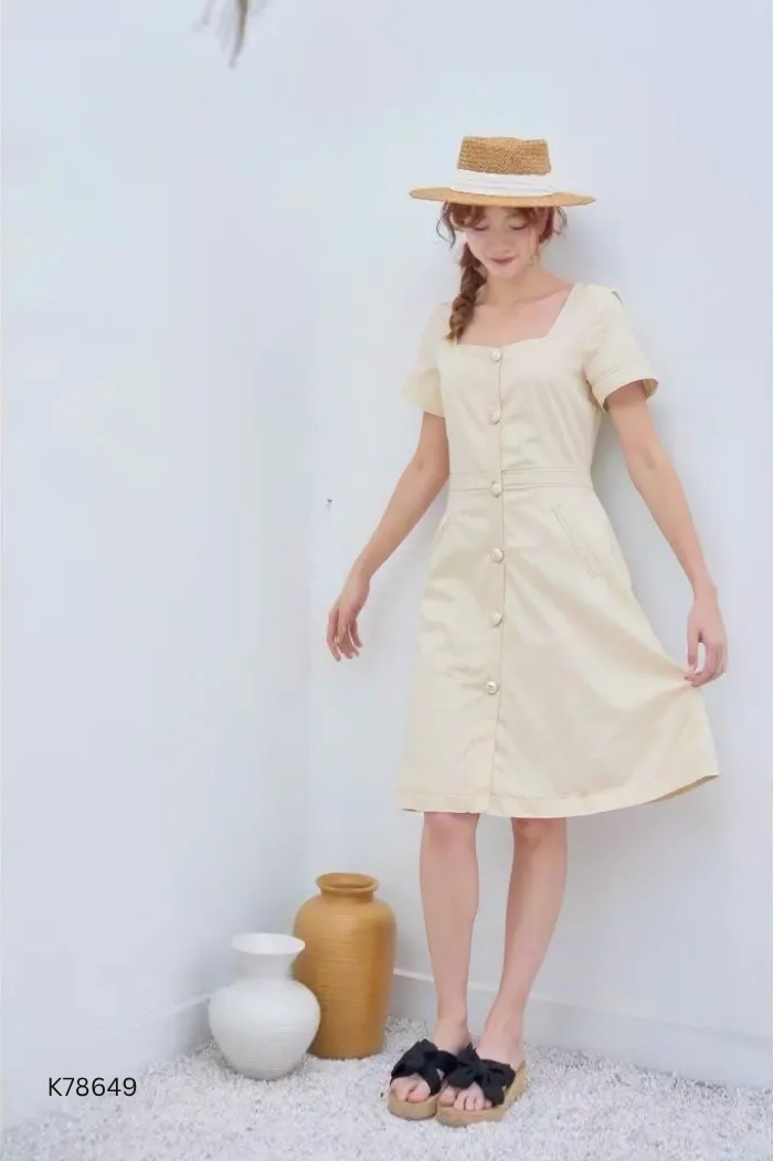 Váy be phối khuy