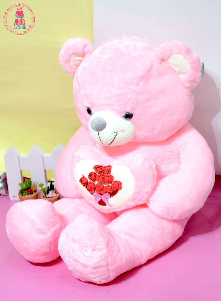 Gấu teddy ôm tim bó hoa hồng nơ