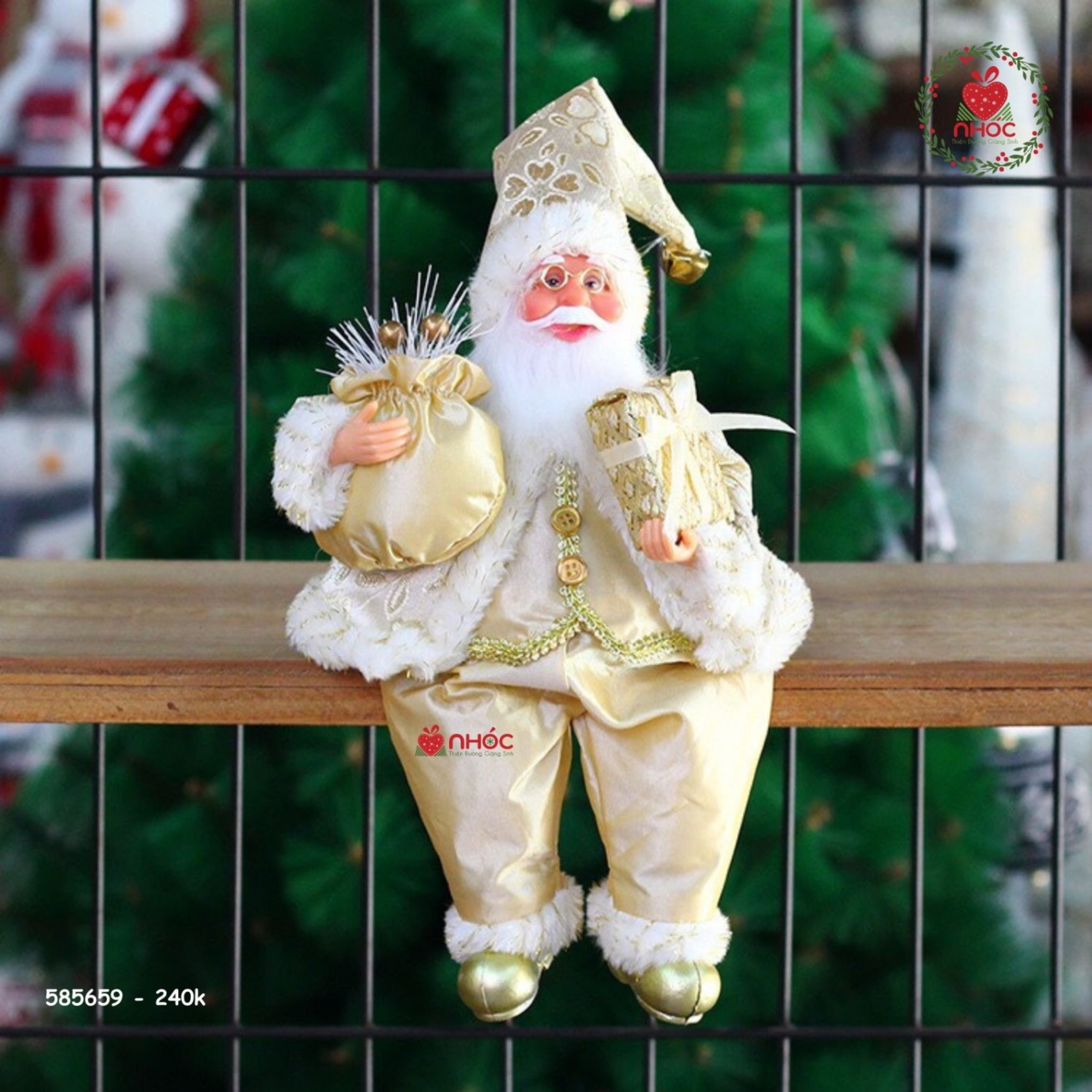 Ông già Noel ngồi ôm túi ngồi mặc áo kim sa - 24001