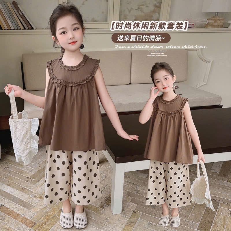 Áo nâu babydoll quần bi xuông bé gái