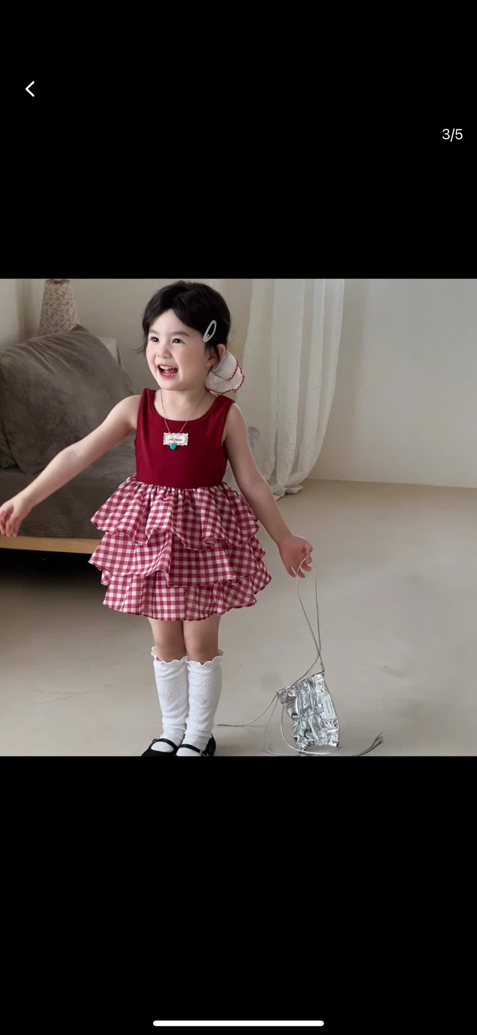 Váy phối tầng caro kèm buộc tóc bé gái