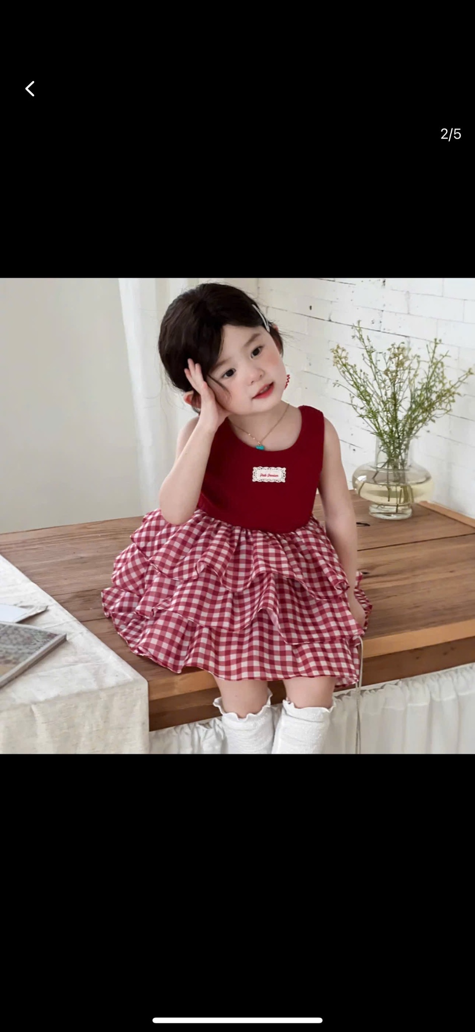 Váy phối tầng caro kèm buộc tóc bé gái