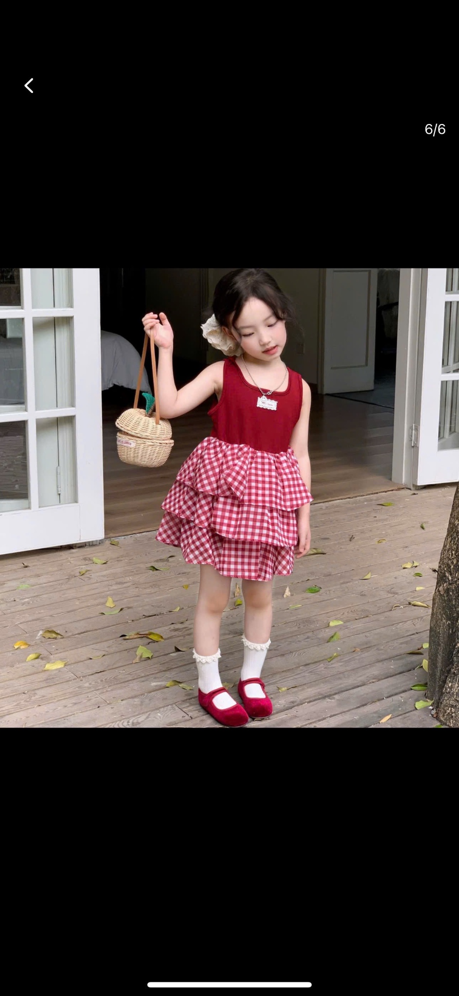 Váy phối tầng caro kèm buộc tóc bé gái