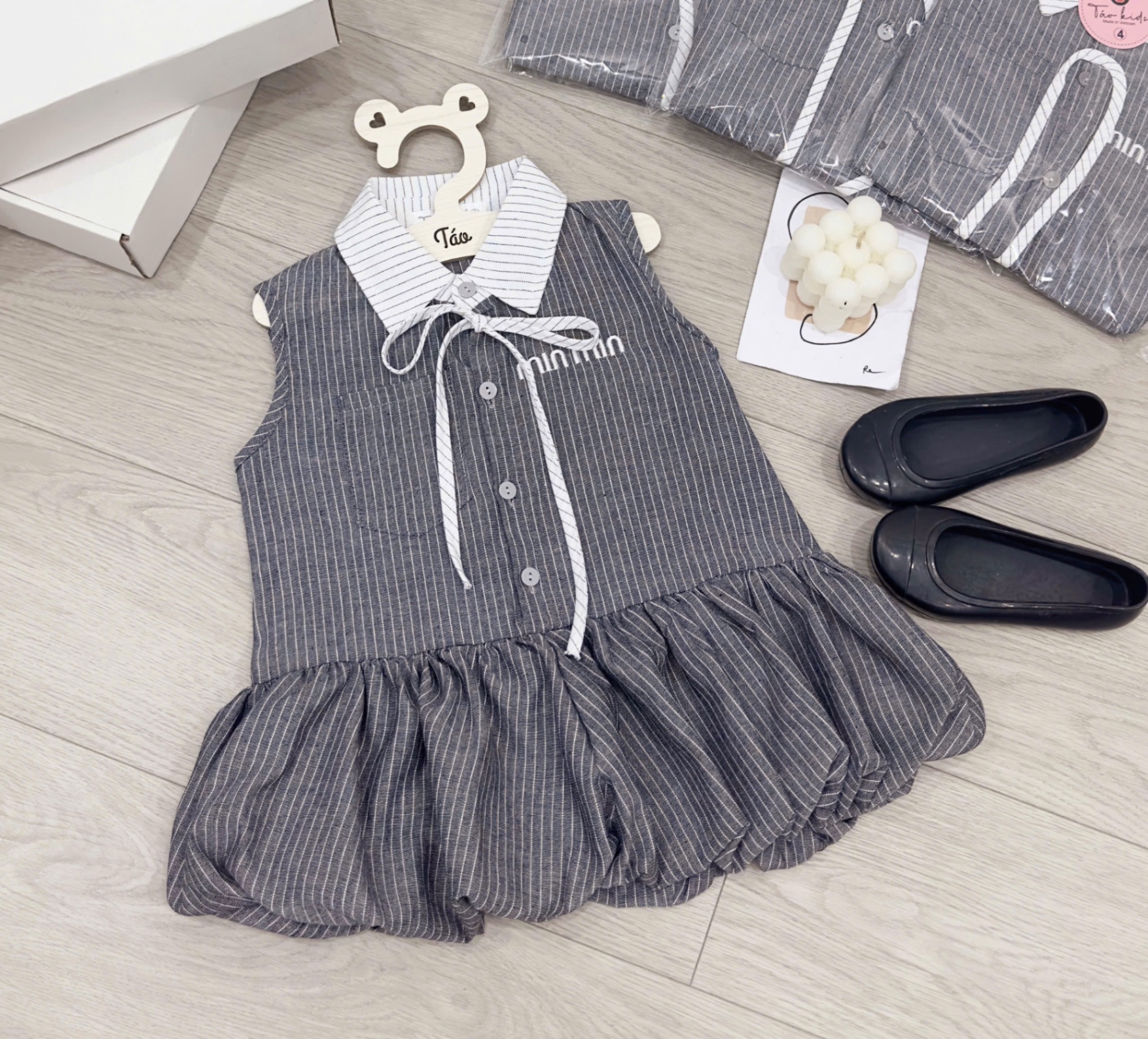 Váy kẻ miu thân bồng bé gái