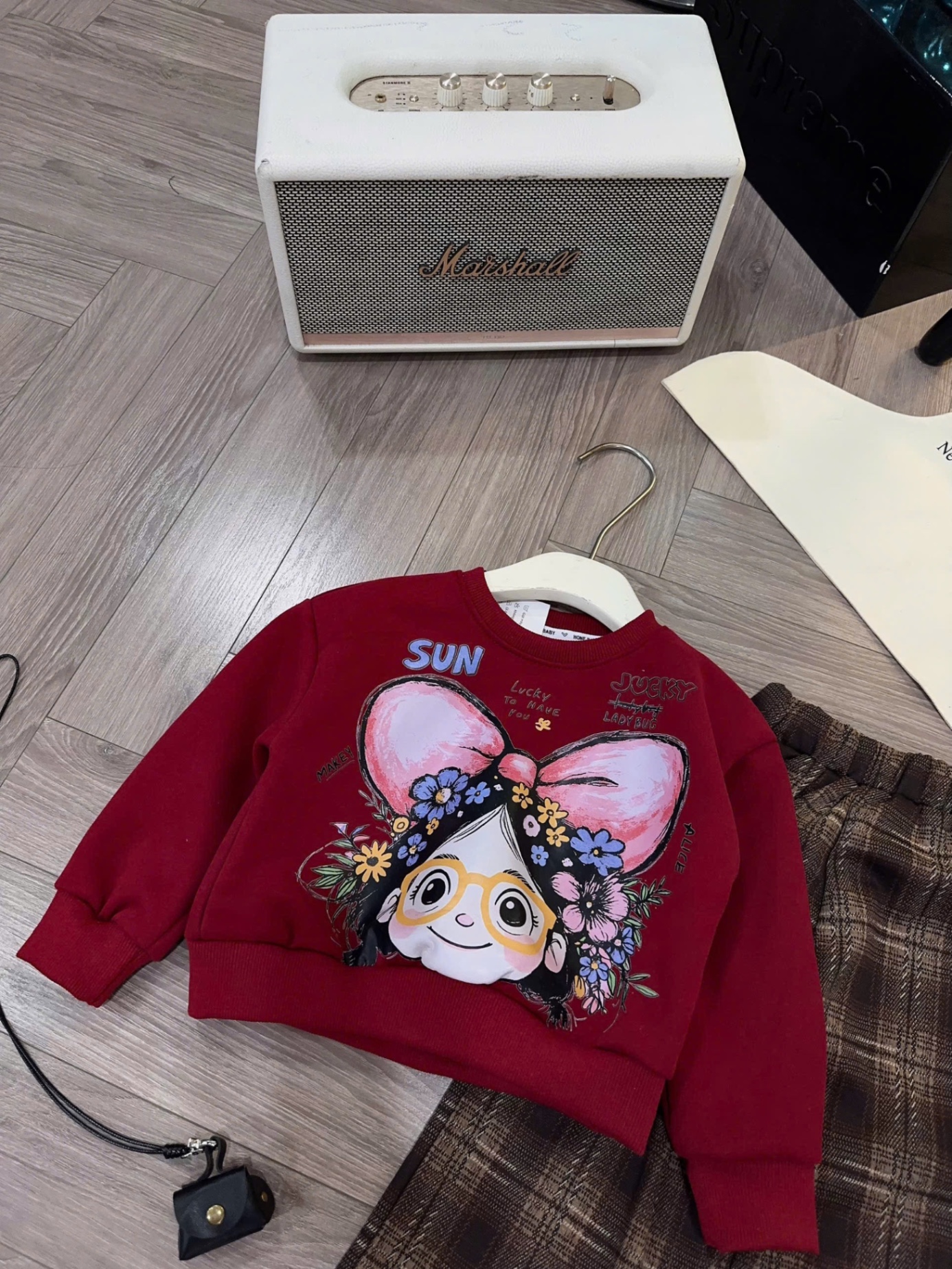 Sét bộ nỉ cô gái đeo nơ quần xuông kẻ bé gái