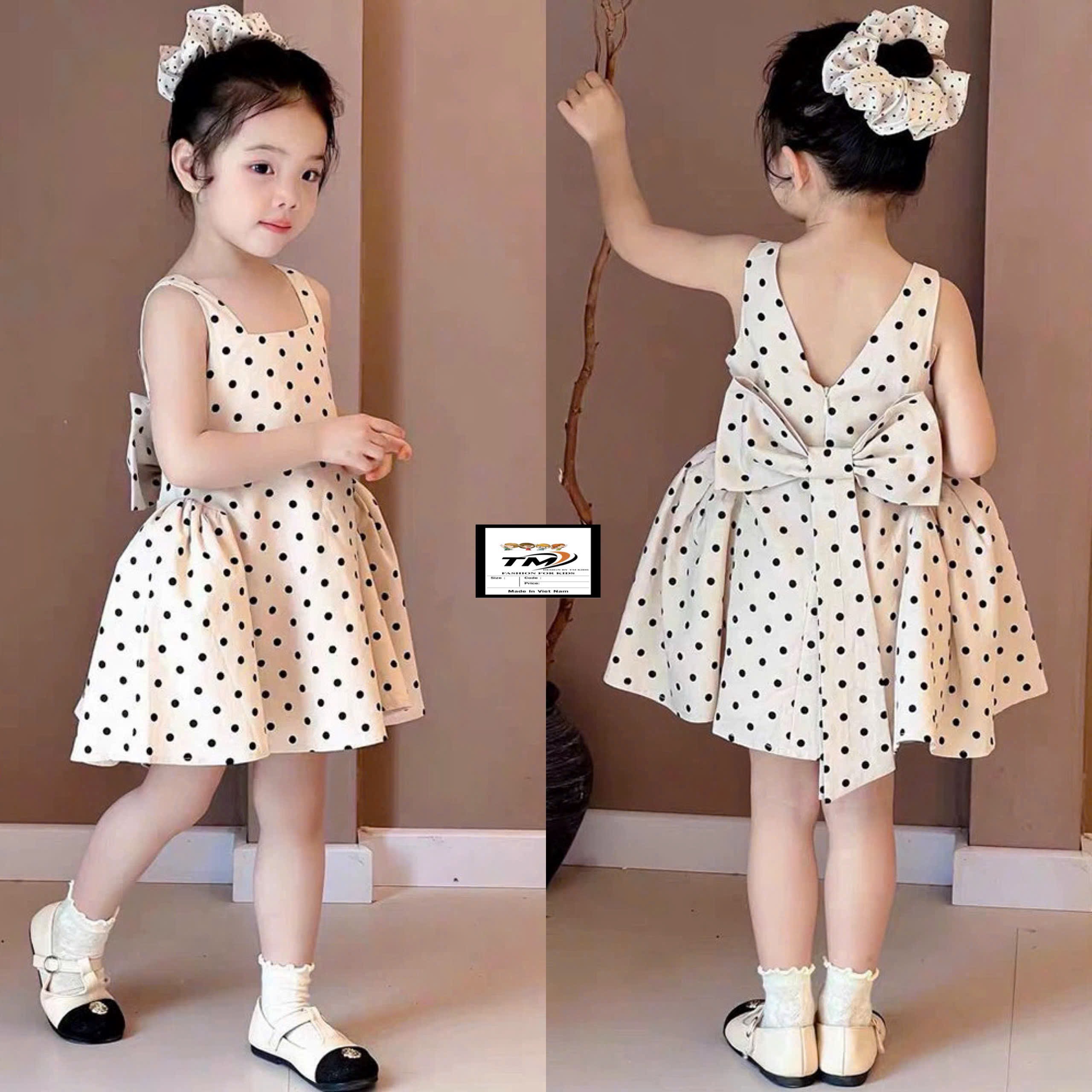 Váy chấm bi nơ sau bé gái