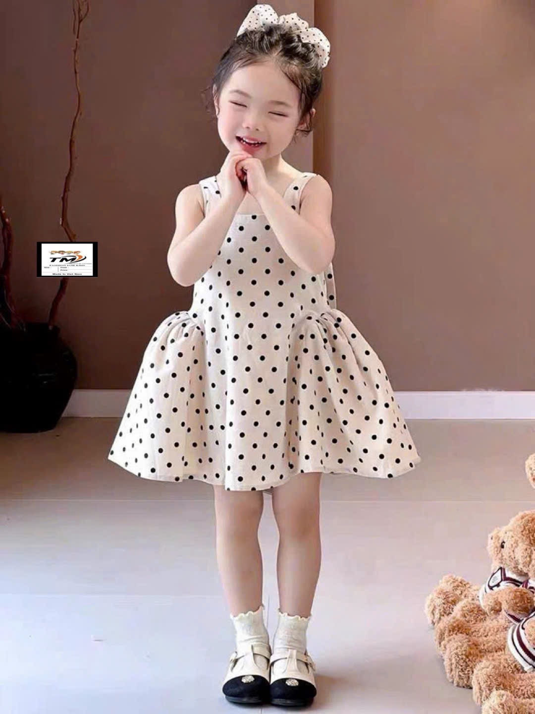 Váy chấm bi nơ sau bé gái