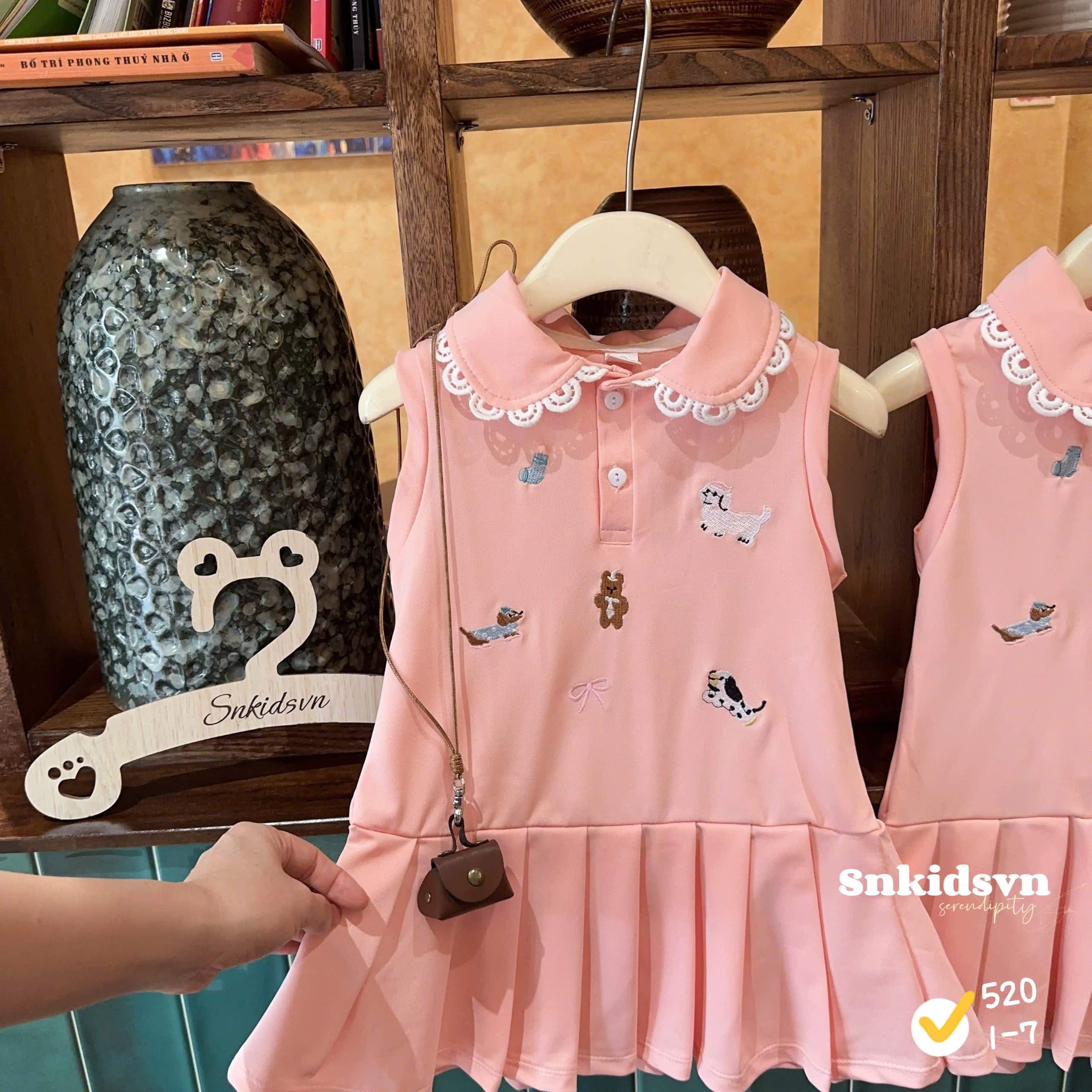 Váy polo hồng bé gái