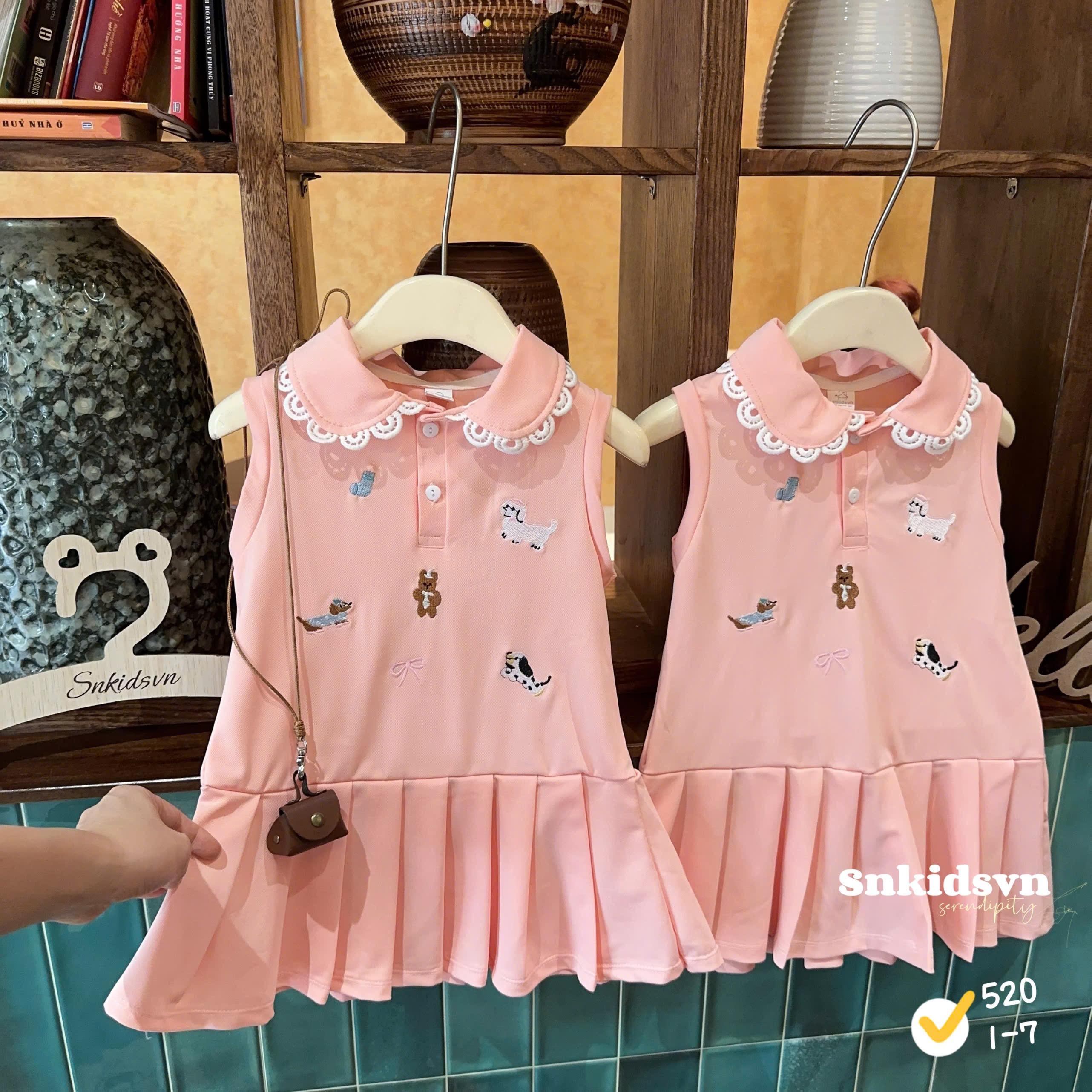 Váy polo hồng bé gái