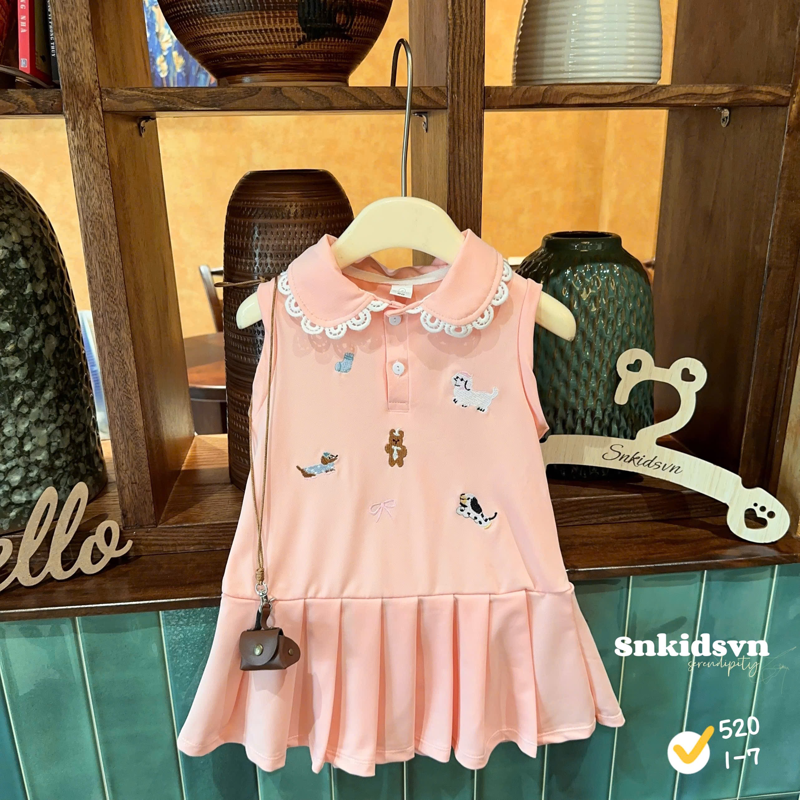 Váy polo hồng bé gái