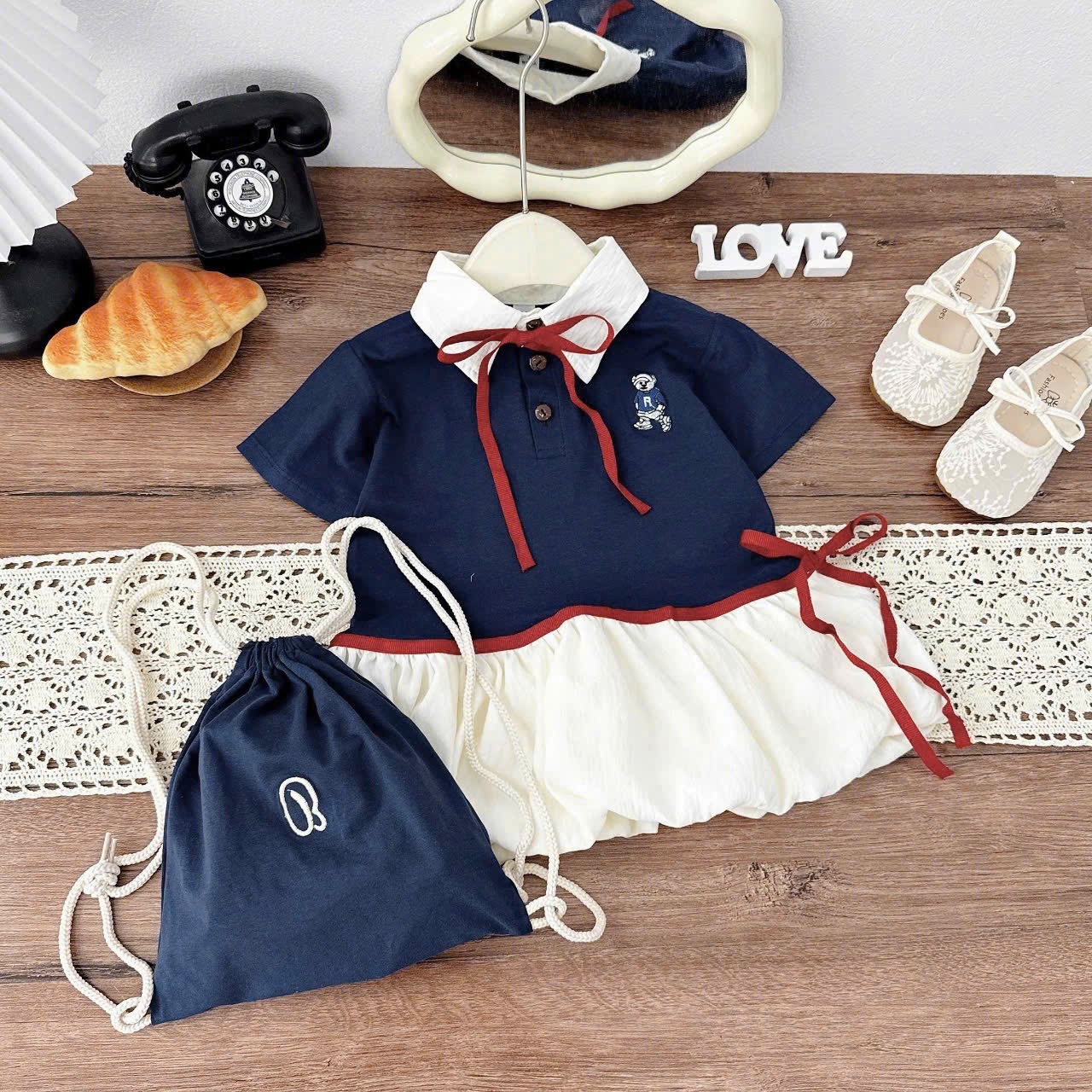 Váy xanh than thân bồng kèm túi bé gái