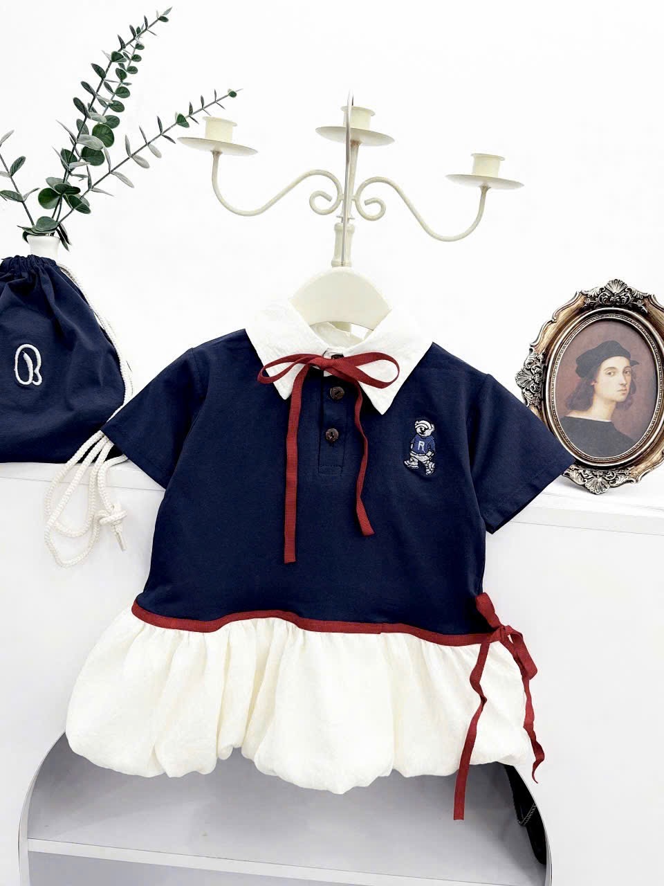 Váy xanh than thân bồng kèm túi bé gái