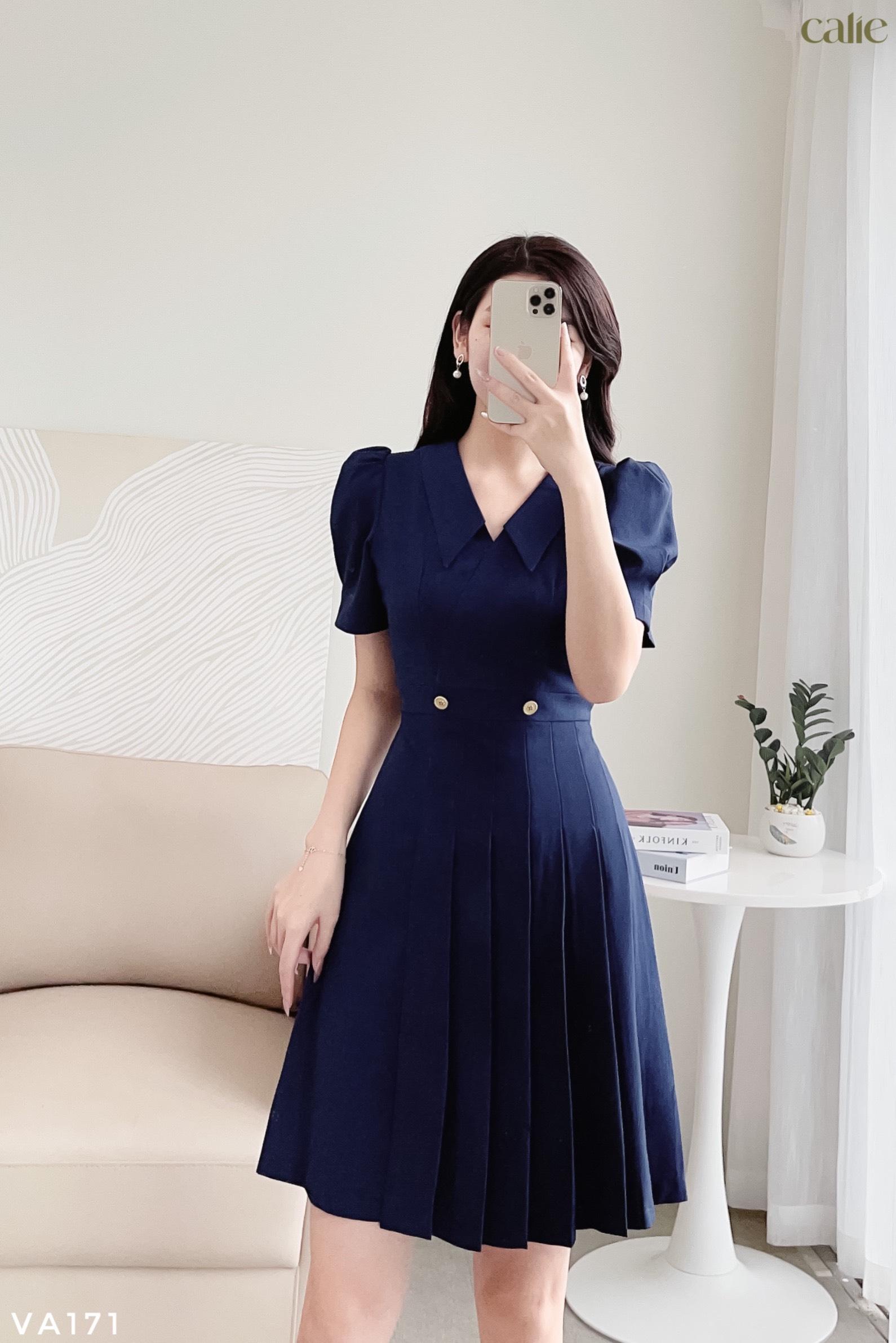 Váy dáng A xếp ly phối cúc đồng thanh lịch