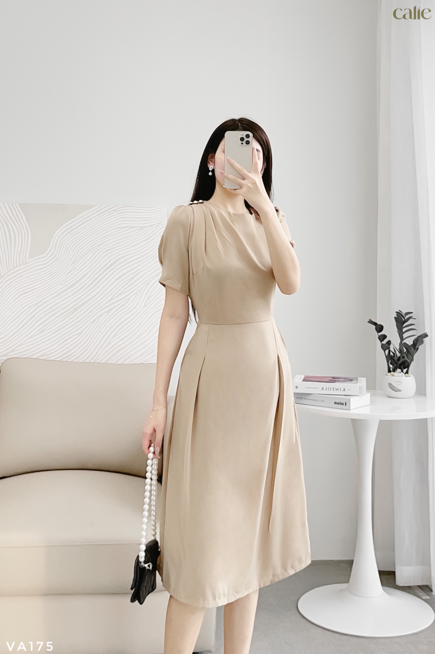 Váy dáng A xếp ly vai phối cúc trai thanh lịch
