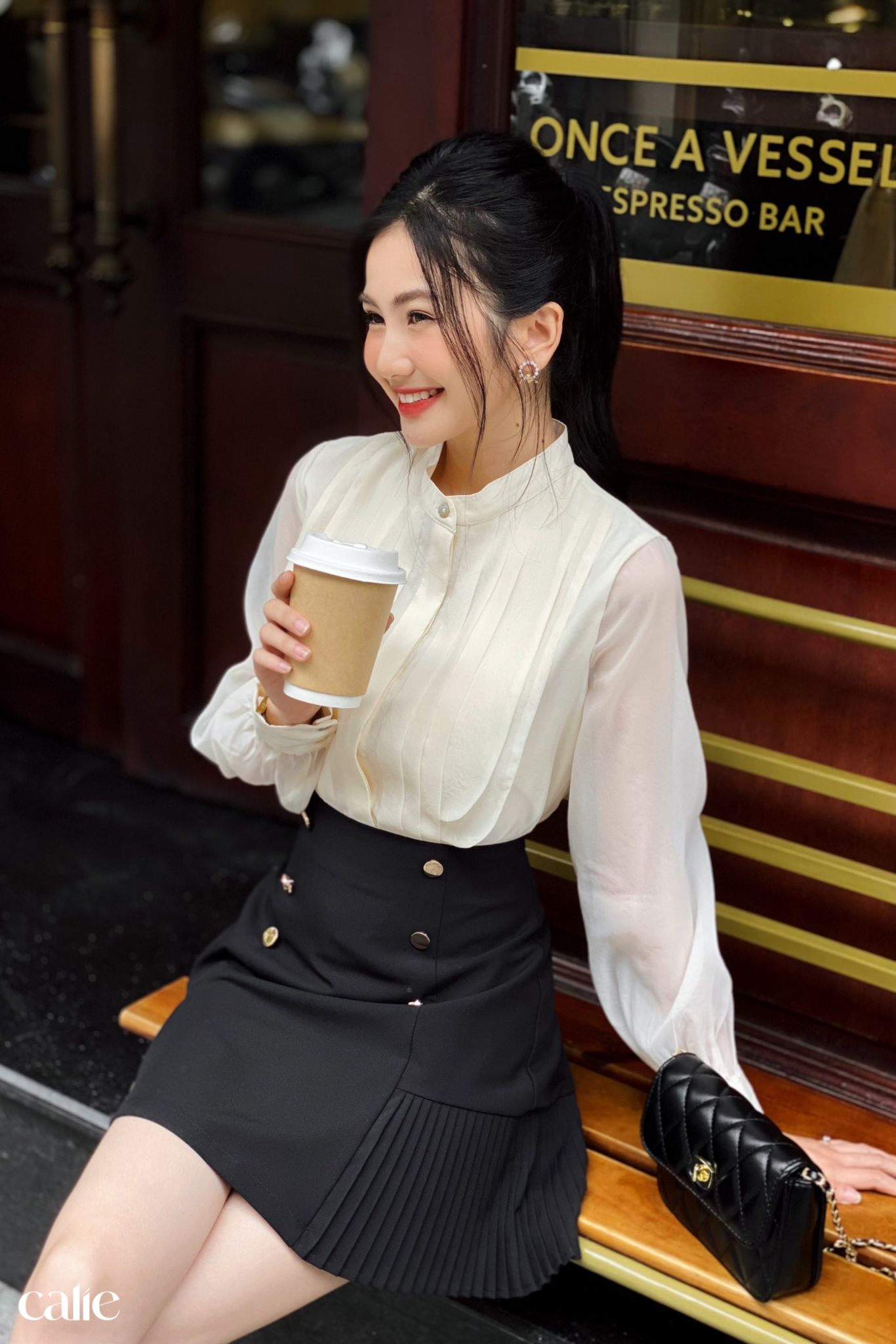 Chân váy A phối xếp ly gấu đính cúc