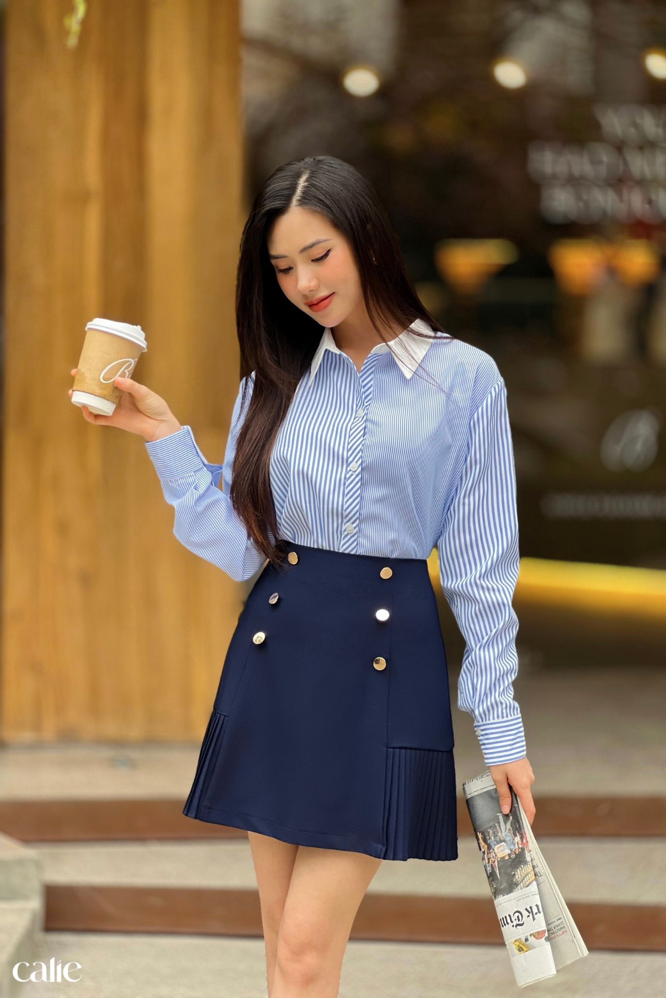Chân váy A phối xếp ly gấu đính cúc