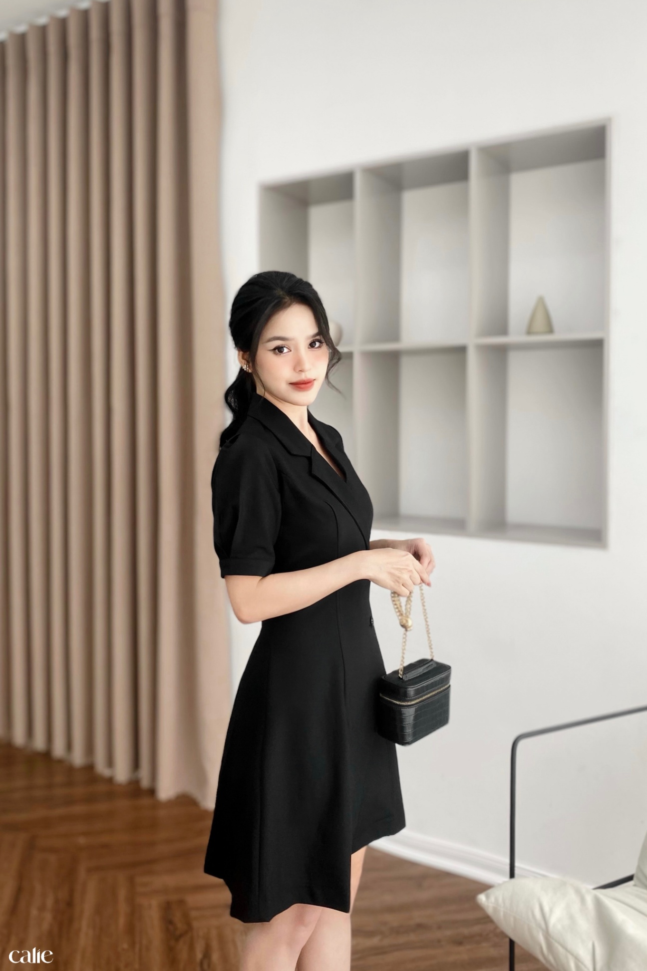 Váy dáng A cổ vest vạt lệch đính cúc