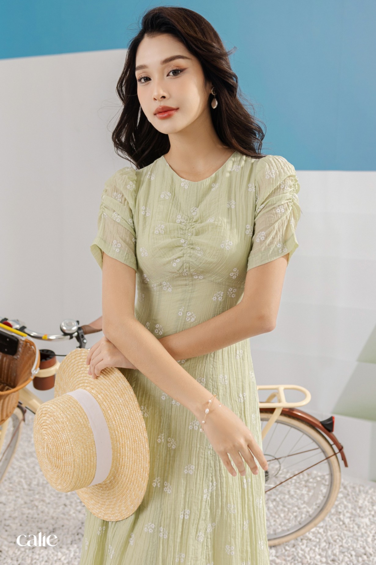 Váy dáng midi tay nhún chun cổ V can chân ngực