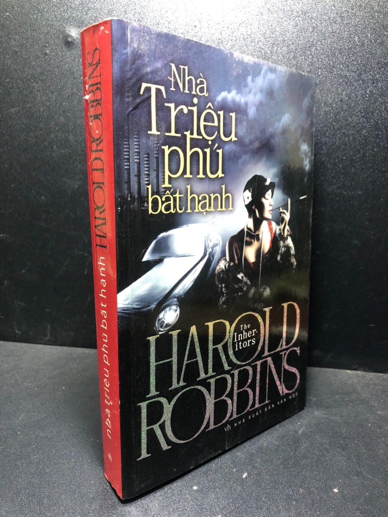 Nhà triệu phú bất hạnh 2011 Harold Robbins mới 80% ố , bẩn ( văn học ) HCM2812 (NSX)