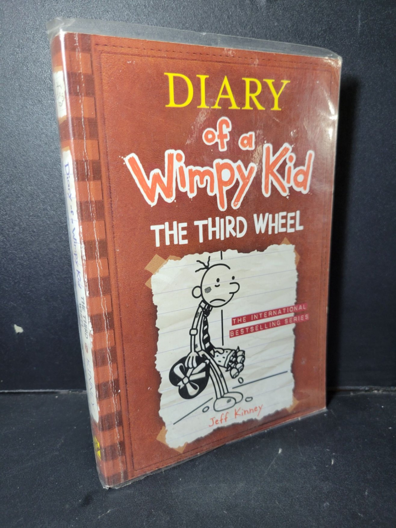 Diary of a wimpy kid 7 The third wheel mới 90% bẩn nhẹ HCM1001 Jeff Kinney NGOẠI VĂN (NSX)